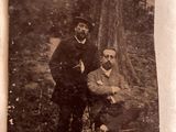 an old photo of a man and a woman posing for a picture