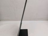 the back of a tablet computer sitting on top of a white table