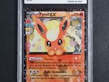 a close up of a pokemon card on a black surface