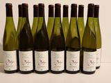 six bottles of wine are lined up in a row on a table