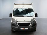 the white van is parked in the empty room of the building