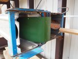 a green container sitting on top of a metal shelf