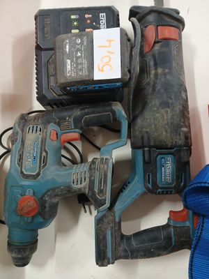 two electric tools that are sitting on a table