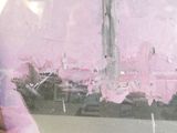a painting of a pink cityscape in a glass case