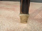 a close up of a clock on the floor