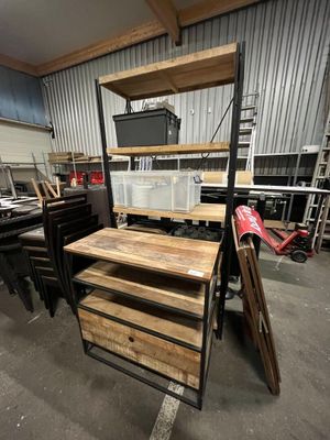 a lot of wood and metal items in a garage