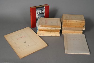 several books are stacked on top of each other on a table