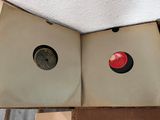 a open book with a red button in it