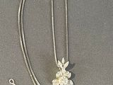sterling silver necklace with a flower pendant and a chain