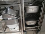 a kitchen with a lot of pots and pans in it