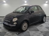 a picture of a small black car on a checkered floor