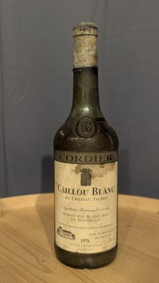 a bottle of wine that is sitting on a table