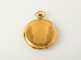 an image of a gold pocket watch on a white surface
