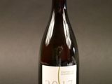 a bottle of wine that is sitting on a table