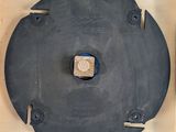 a wooden box that has a metal object inside of it