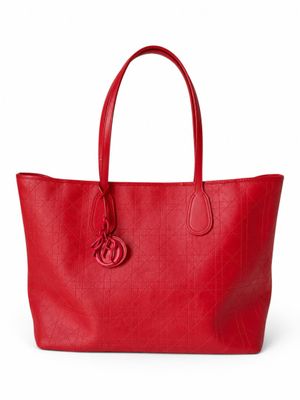 a red leather tote bag on a white background