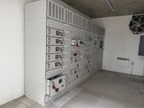 a room with a bunch of electrical equipment on the wall