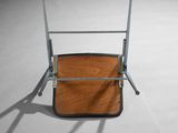 a chair that has a wooden seat and a metal frame