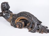 a statue of a woman sitting on top of a table