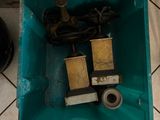 a blue container filled with tools on a tiled floor