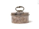 an old silver box with a rope handle on a white background