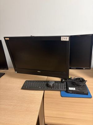 two computer monitors and a keyboard on a desk