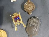 a lot of medals that are laying on a table