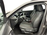 the interior of a car with the door open and the driver ' s seat down