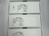 several business cards are stacked on top of each other on a table