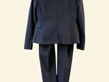 an image of a suit on a hanger on a wall