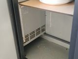 a microwave that is open and has a pan inside of it