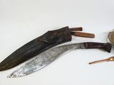three different types of knives on a white surface