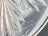 a clear glass bowl with a flower design on it