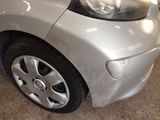a close up of a car ' s headlight and front bumper