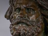 statue of a man with a beard and a bearding mustache