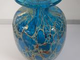 a blue glass vase with a number on it