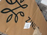 a cardboard box with a sign that says zncs on it