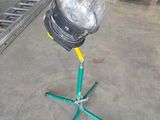 a light that is on a tripod in a garage