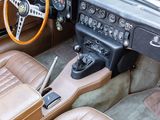 a car dashboard with a steering wheel and a steering control