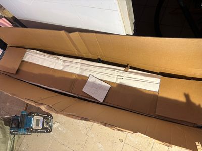 a cardboard box that has a piece of paper in it