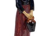 figurine of a woman with a jug of water in her hand