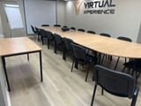 the conference room is empty and ready to be used as a virtual experience