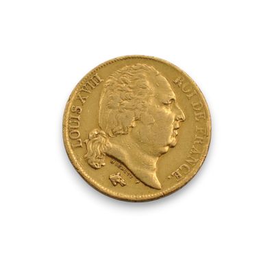 a close up of a coin on a white surface with a white background