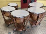 four different types of musical instruments sitting on the floor