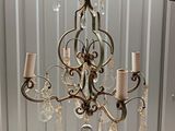 a chandelier hanging from the ceiling in a room