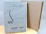 un cahier ouvert sur lequel est dessiné un serpent