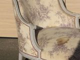 a chair that is sitting in front of a window