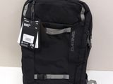 the back of a black backpack with a tag attached to it