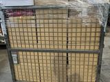 a cart full of boxes in a warehouse filled with pallets