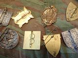 a lot of metal items that are laying on a bed